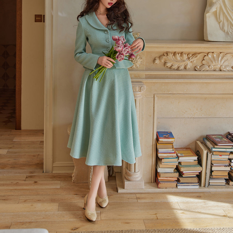 Bright blue lady's retro jacket and Hepburn skirt