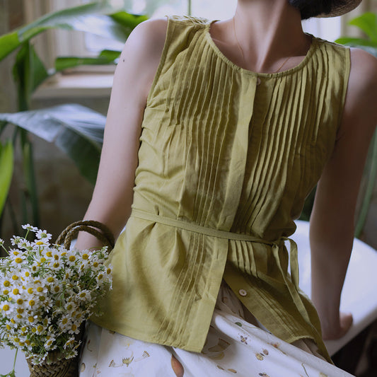 Light green sleeveless pleated top