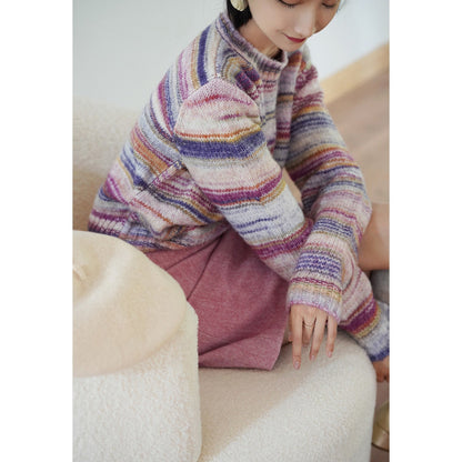 Blurred rainbow-colored knit sweater and scarf