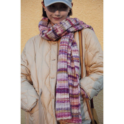 Blurred rainbow-colored knit sweater and scarf