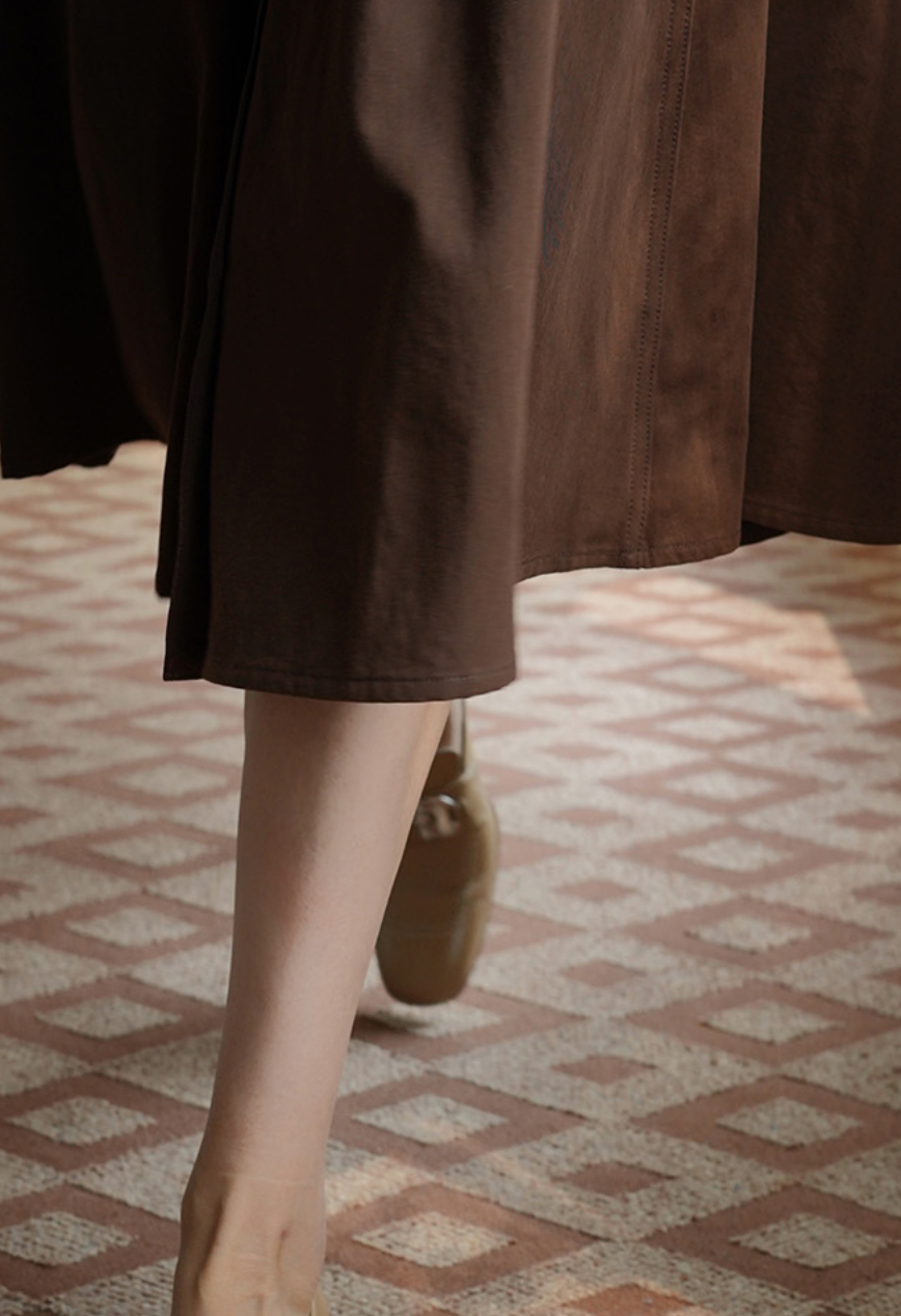 Lady's brown umbrella skirt