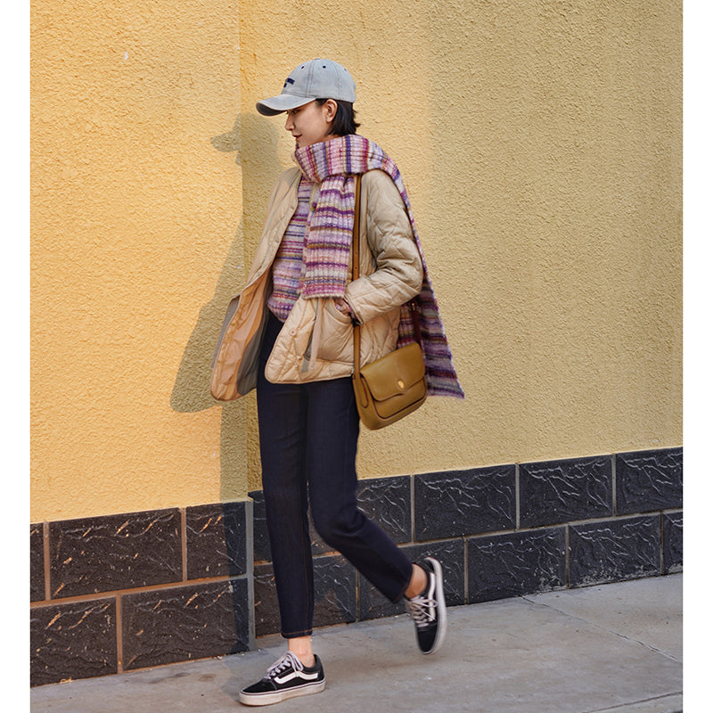 Blurred rainbow-colored knit sweater and scarf