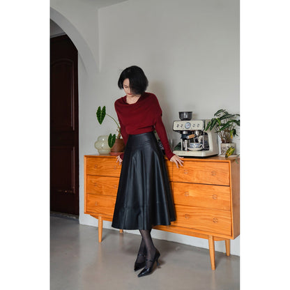 Jet-black lady's high-waisted leather skirt