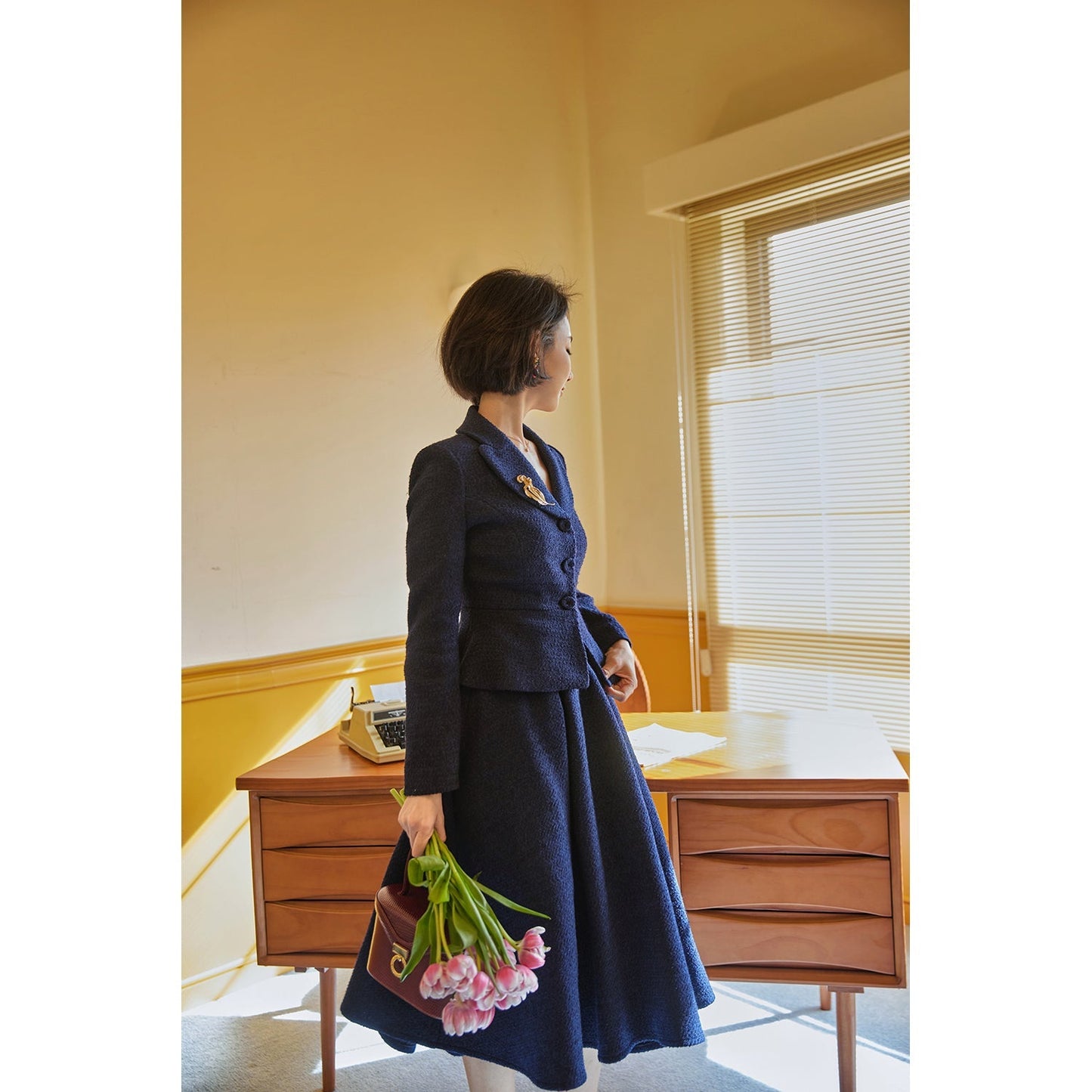 Navy blue actress retro jacket and Hepburn skirt