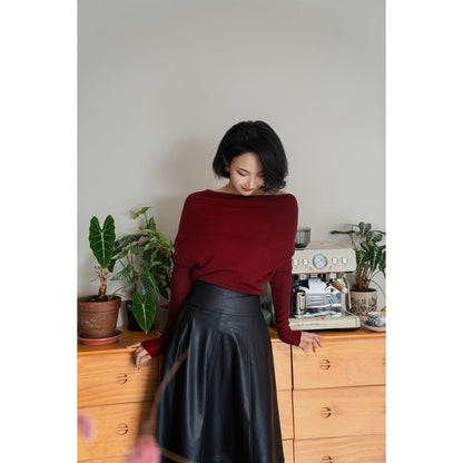 Jet-black lady's high-waisted leather skirt