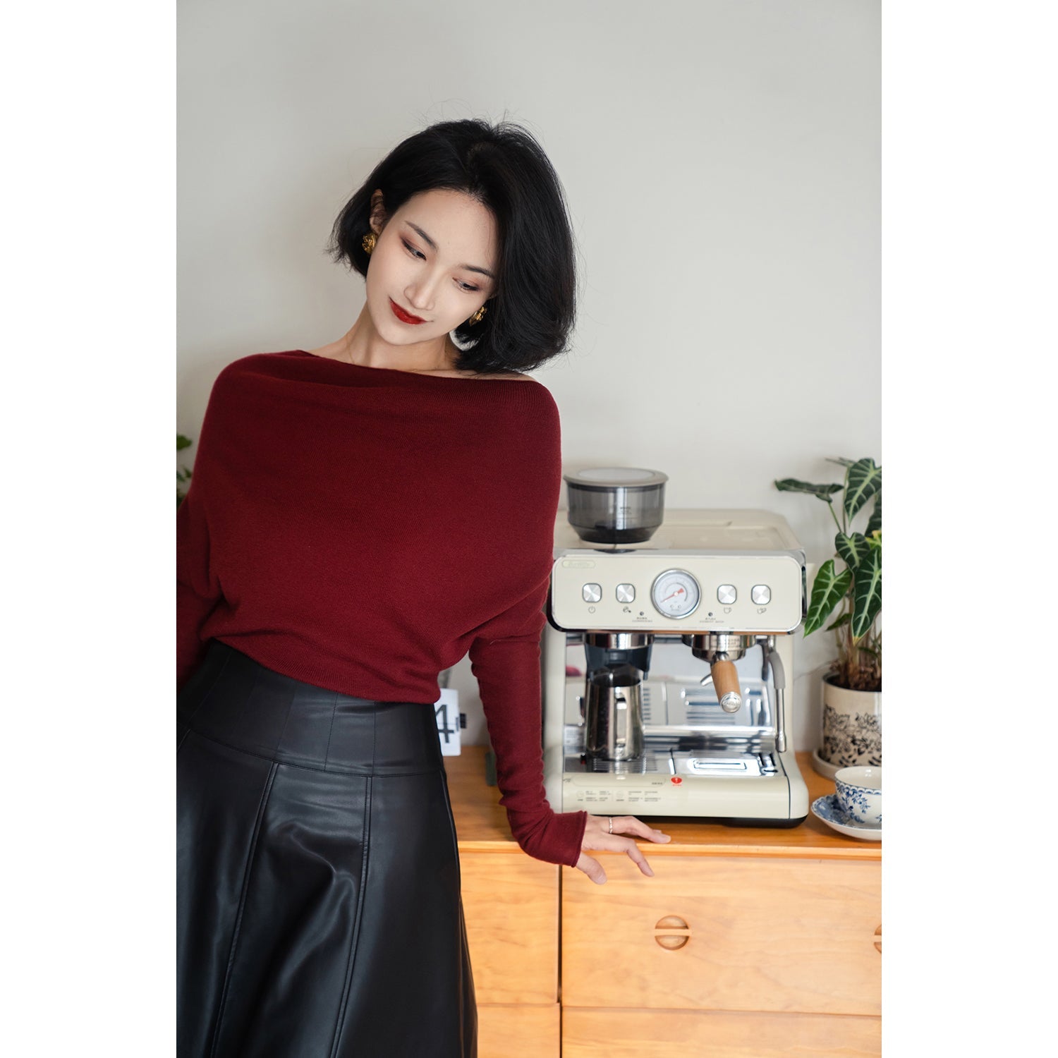 Jet-black lady's high-waisted leather skirt