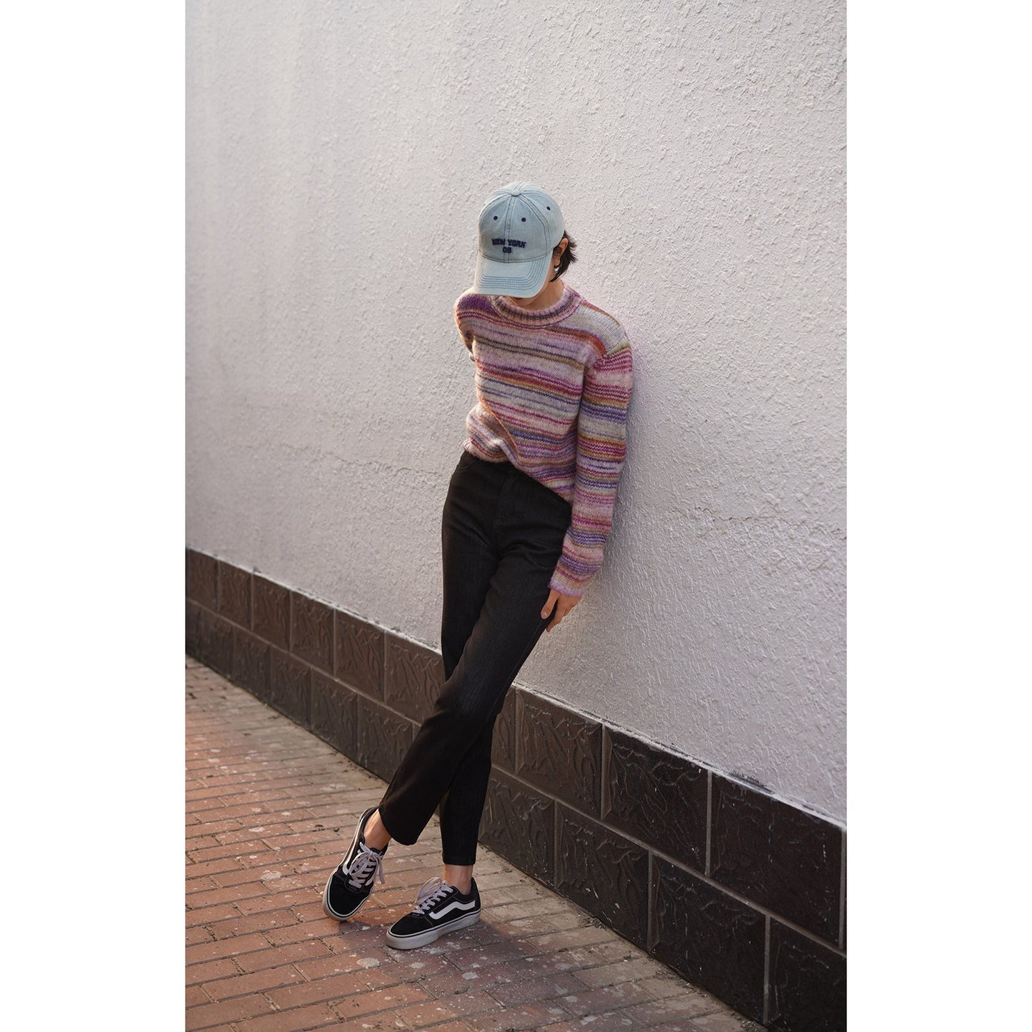 Blurred rainbow-colored knit sweater and scarf