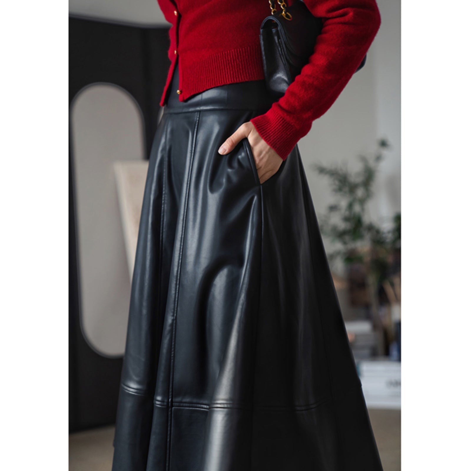 Jet-black lady's high-waisted leather skirt