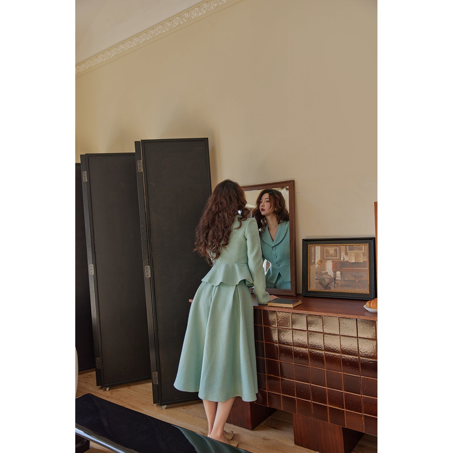 Bright blue lady's retro jacket and Hepburn skirt