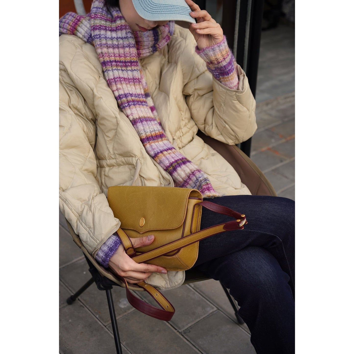 Blurred rainbow-colored knit sweater and scarf