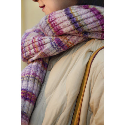 Blurred rainbow-colored knit sweater and scarf