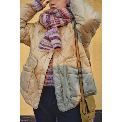 Blurred rainbow-colored knit sweater and scarf