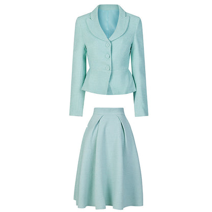 Bright blue lady's retro jacket and Hepburn skirt