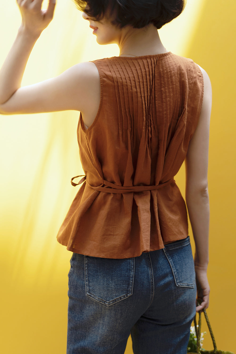 gray brown sleeveless pleated tops