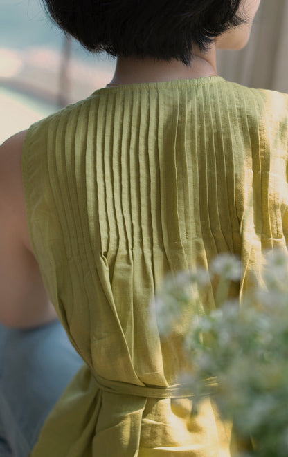 Light green sleeveless pleated top