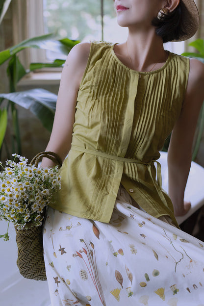 Light green sleeveless pleated top