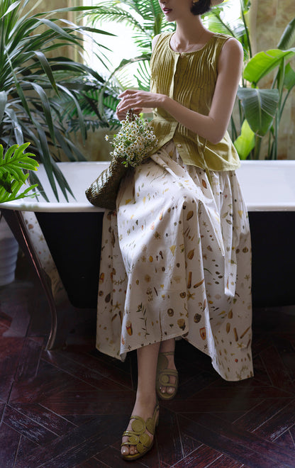 Light green sleeveless pleated top