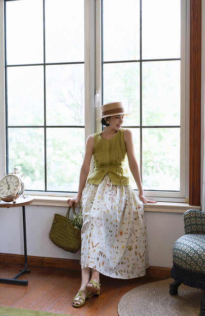 Light green sleeveless pleated top