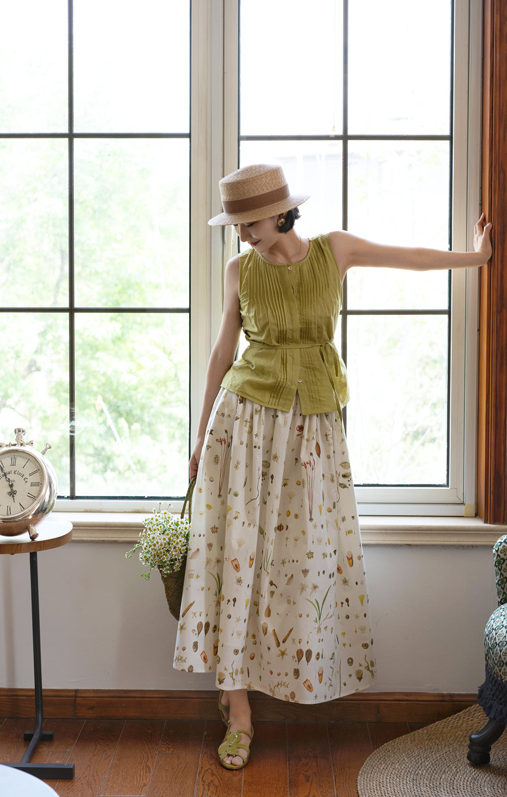 Light green sleeveless pleated top