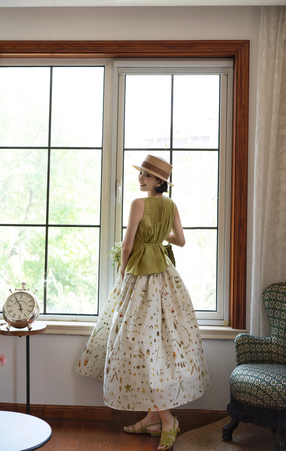 Light green sleeveless pleated top