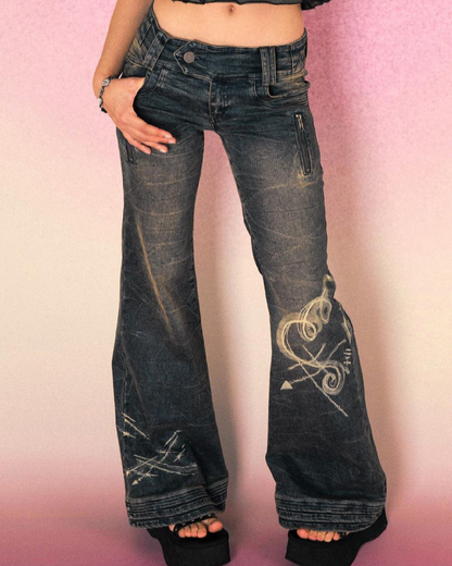 Washed and distressed vintage heart flare jeans